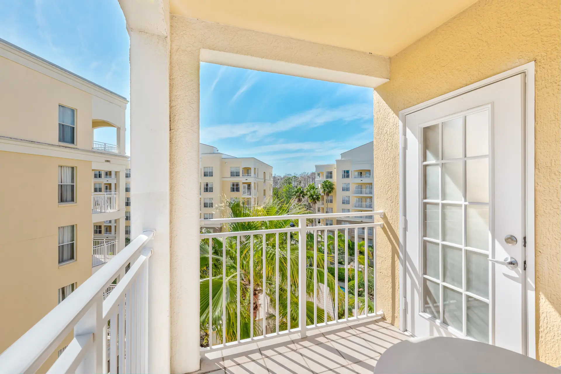 Resort balcony with pool area view at Vacation Village at Parkway