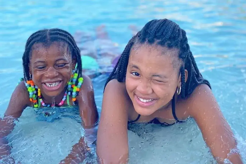 Kids playing together in the resort pool