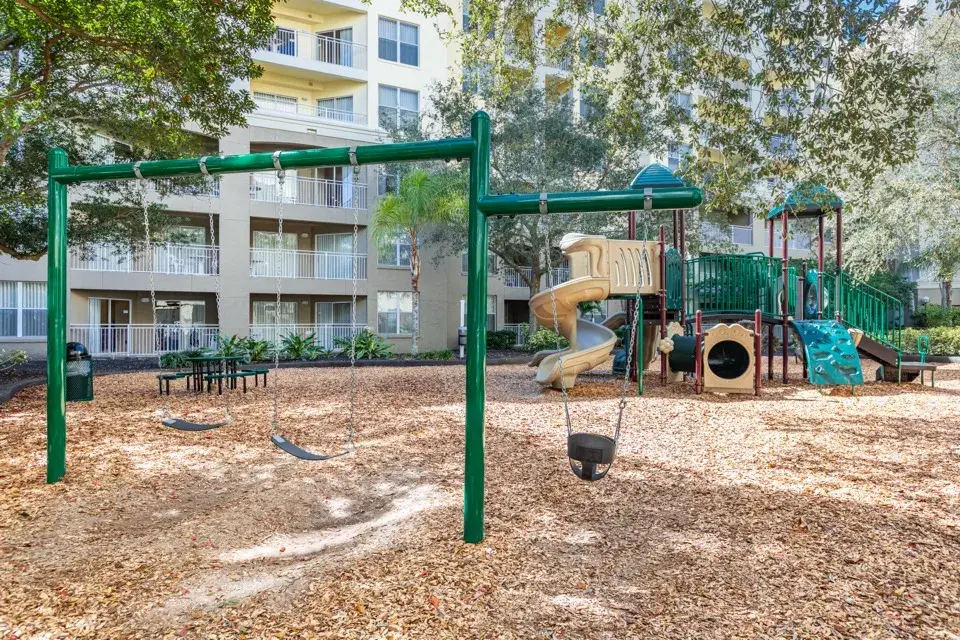 Children’s playground with swings and multi-structure play set