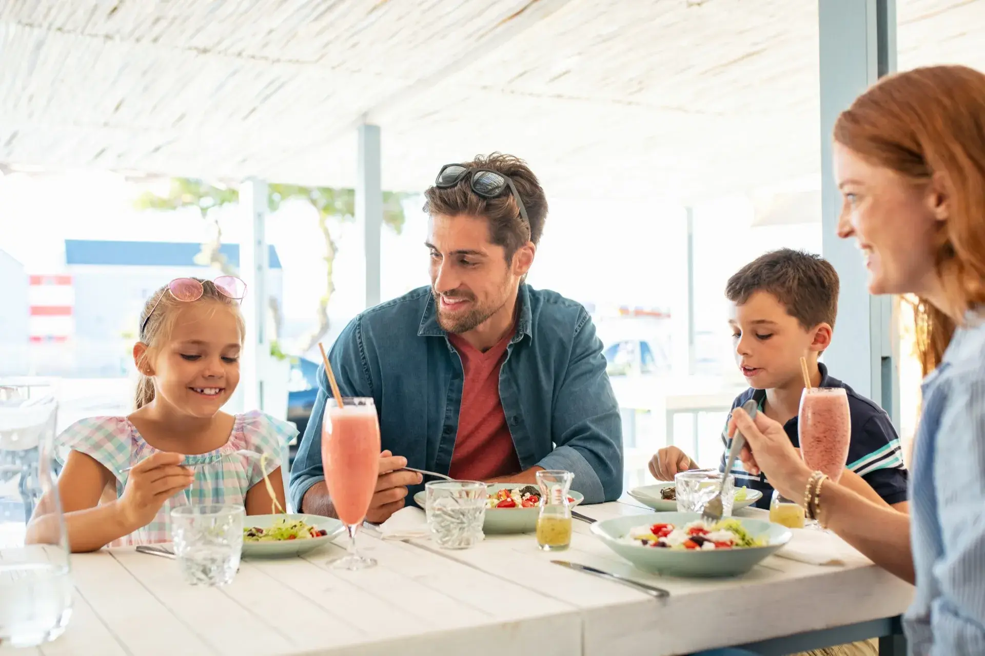 Family enjoying a meal together at a restaurant near the resort