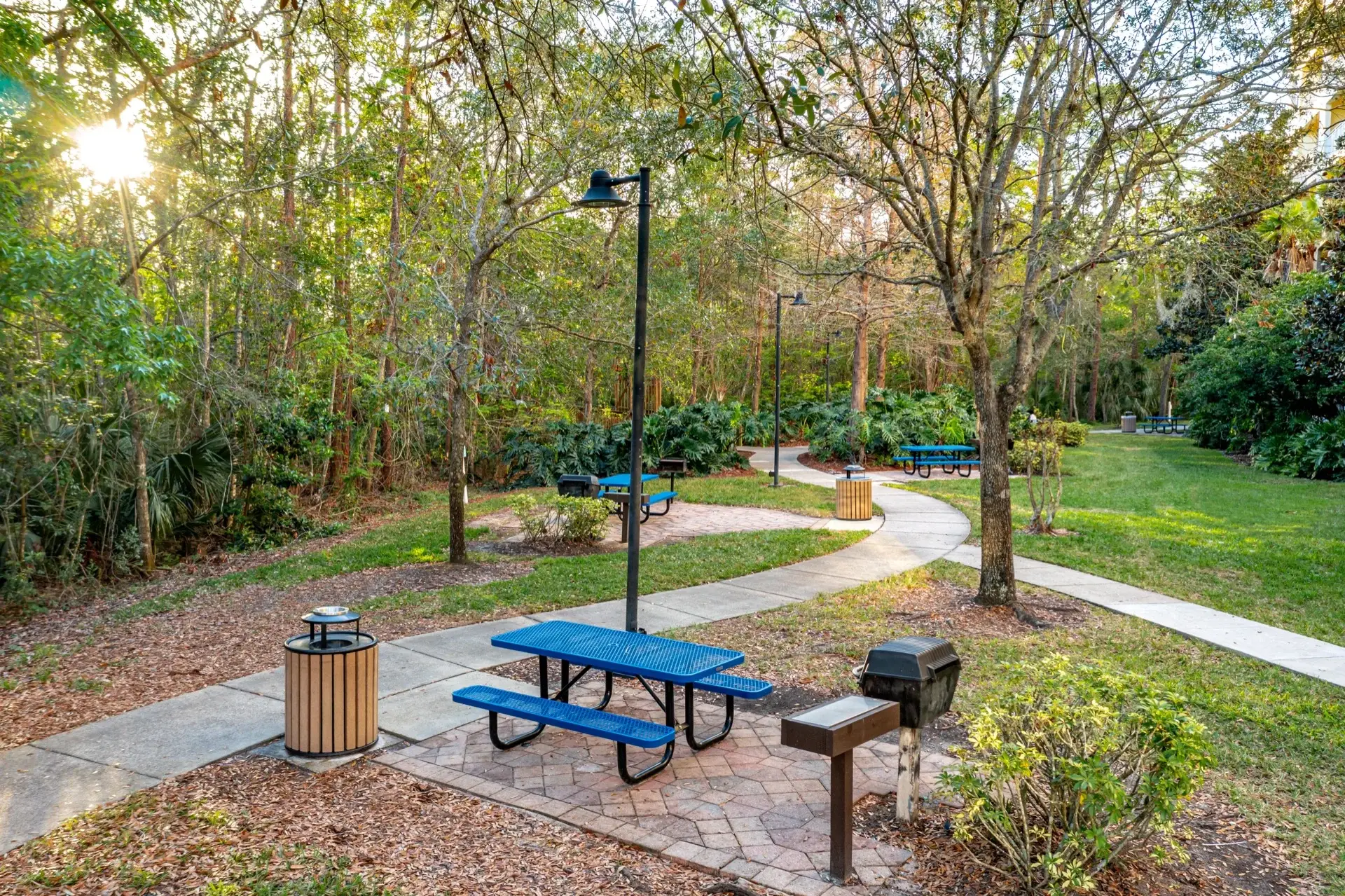 Outdoor barbecue grills and picnic area by Building 10