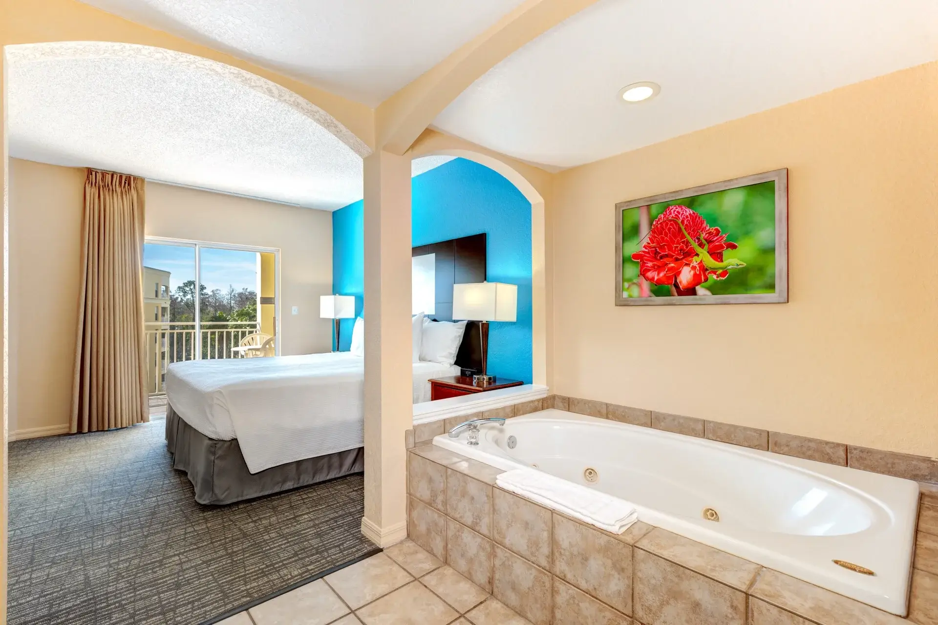 A Suite primary bedroom with jetted tub