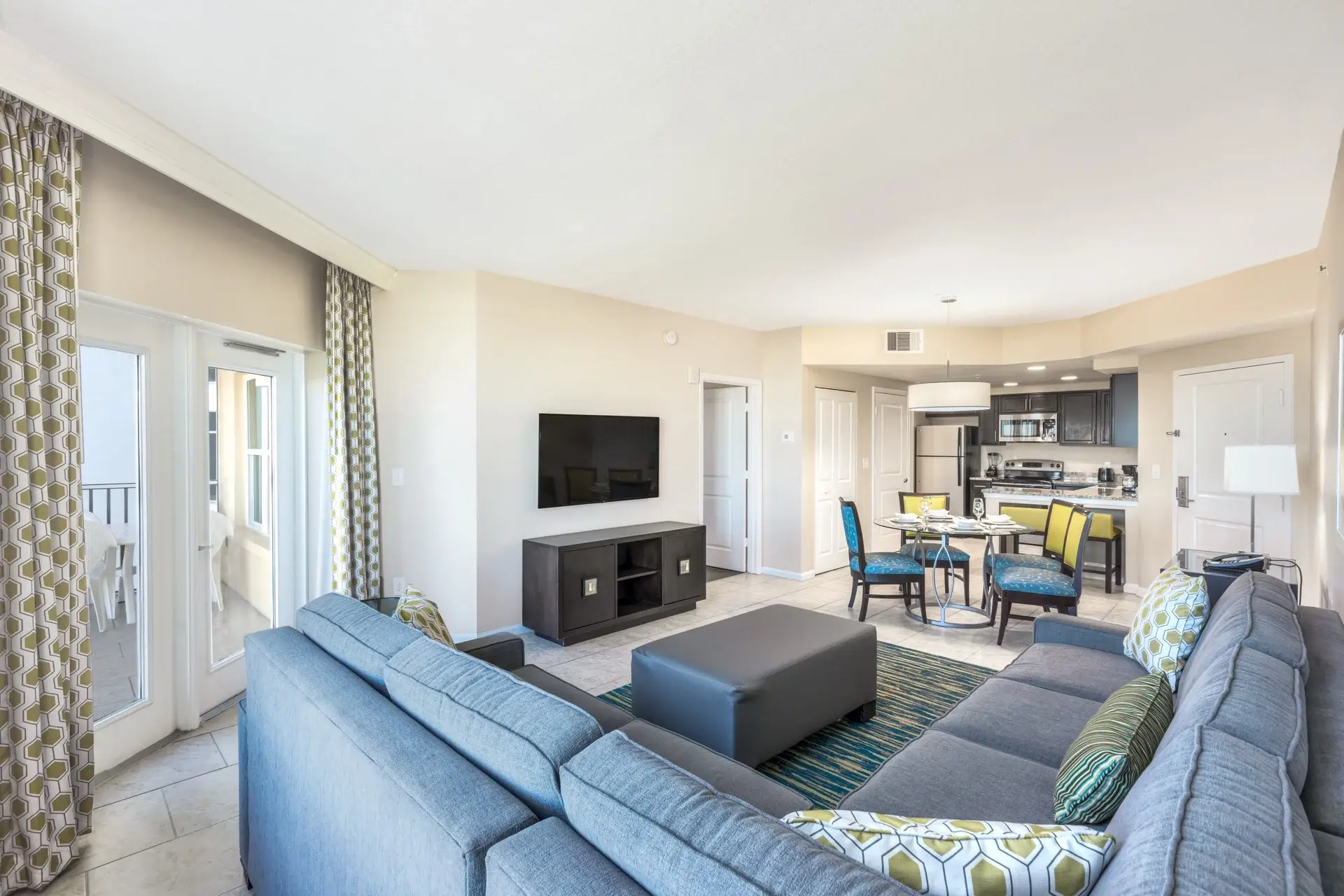 A Suite with a living room and a furnished outdoor balcony