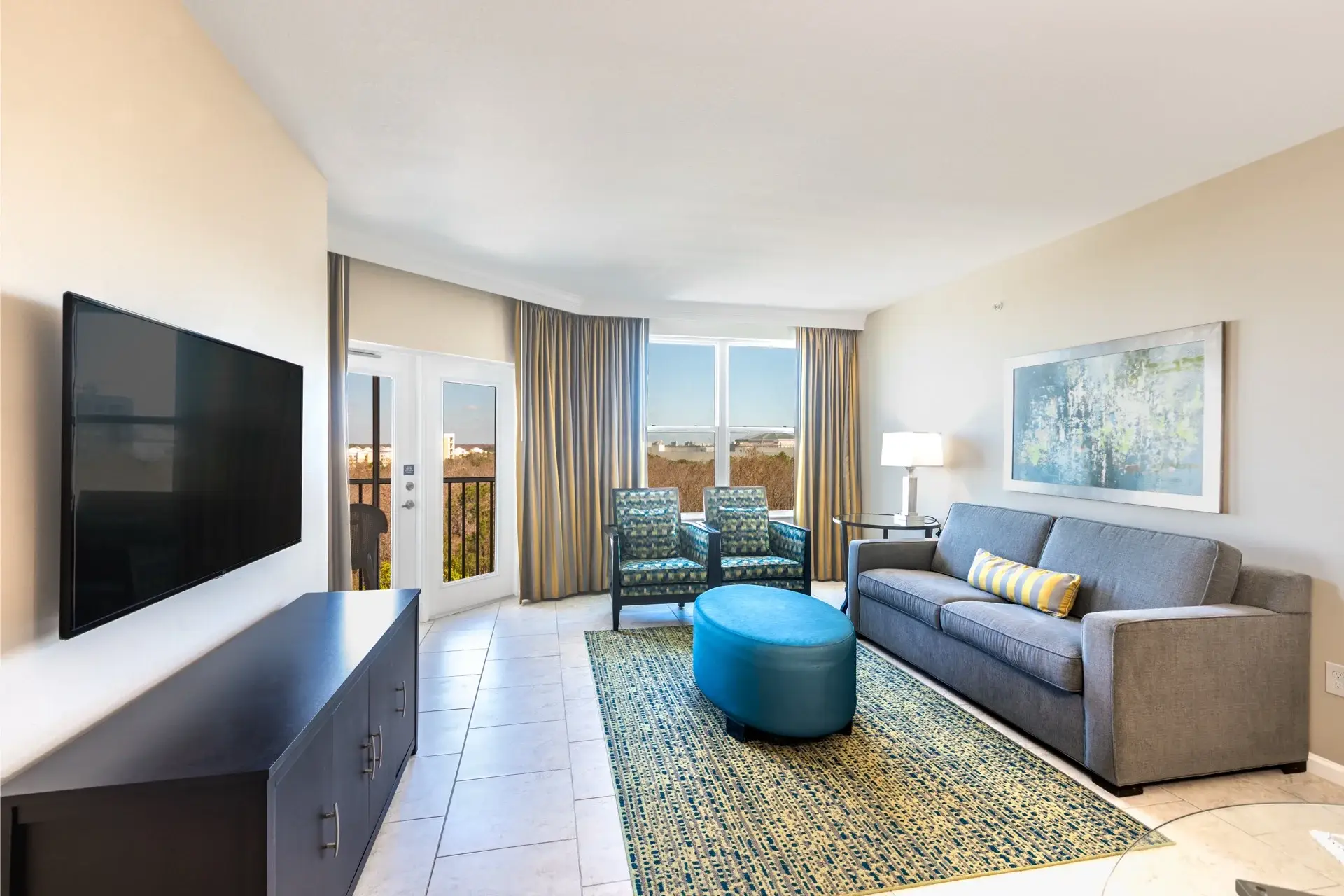 C Suite with living room and furnished outdoor balcony