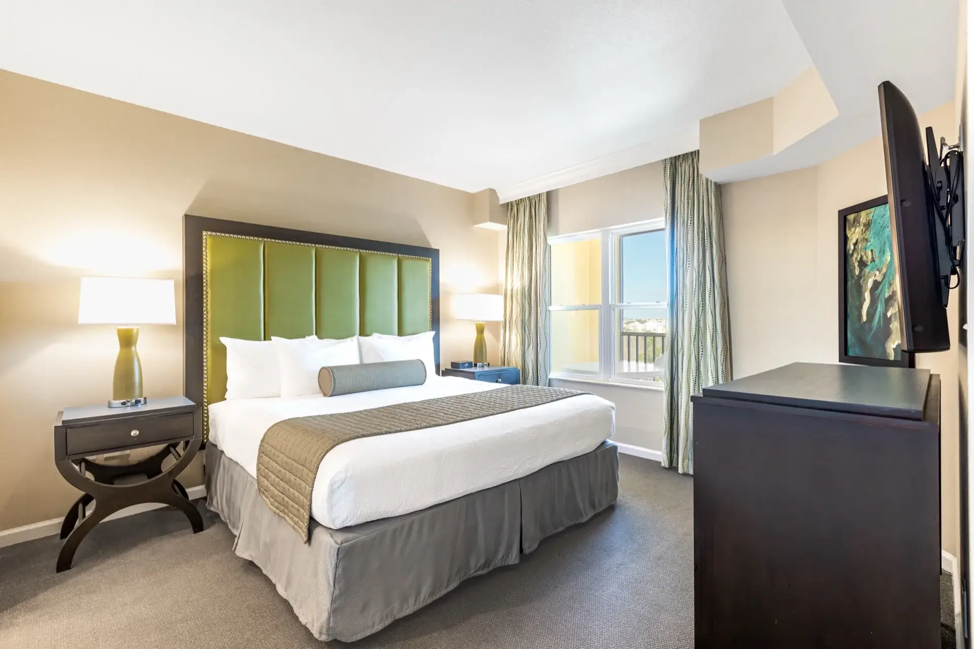 C Suite primary bedroom with a king-size bed