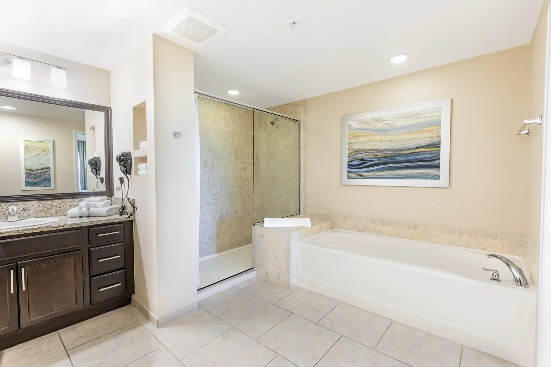 C Suite with separate vanity area and adjoining bathroom